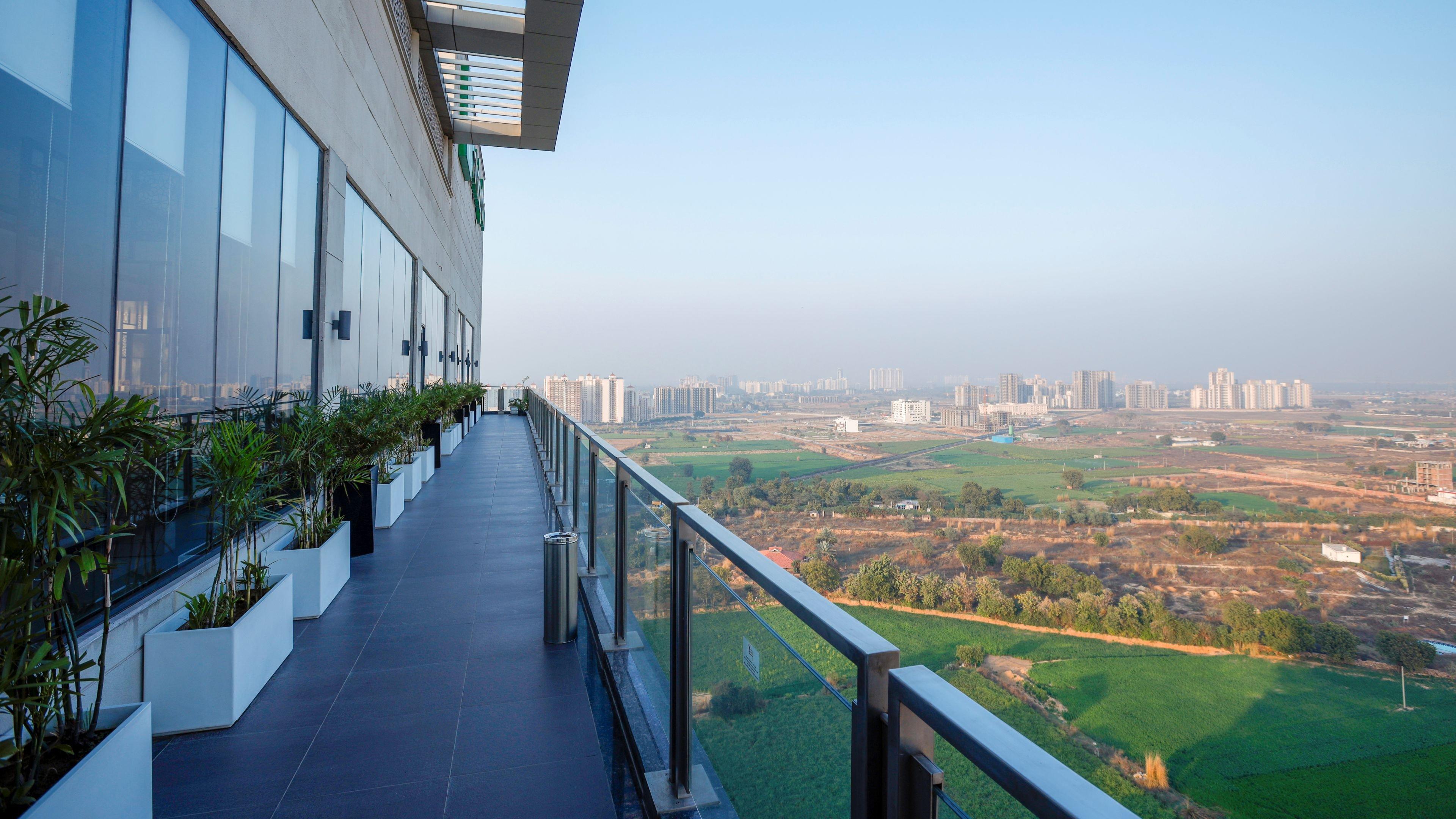 Holiday Inn Gurugram Sector 90 By Ihg Gurgaon Extérieur photo View from the balcony of a residential apartment